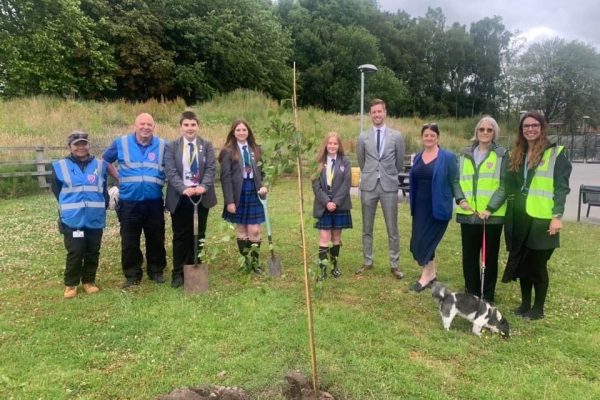 Planting our wellbeing tree with the premises team and Mental Health Ambassadors.